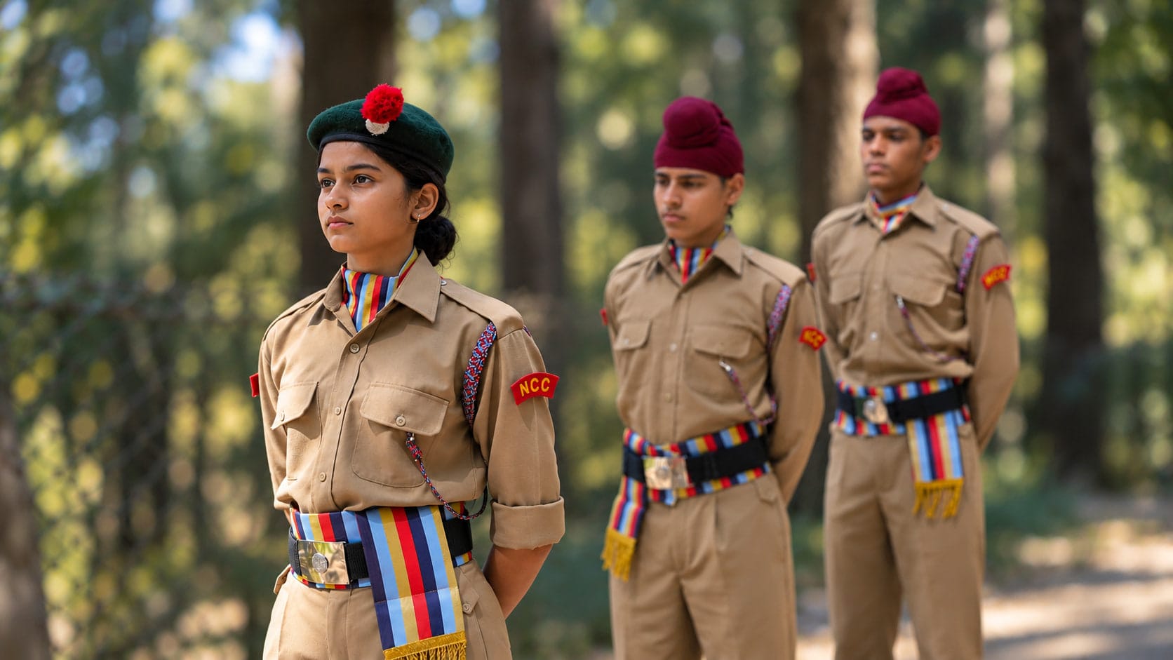 NCC cadets standing in line among the trees